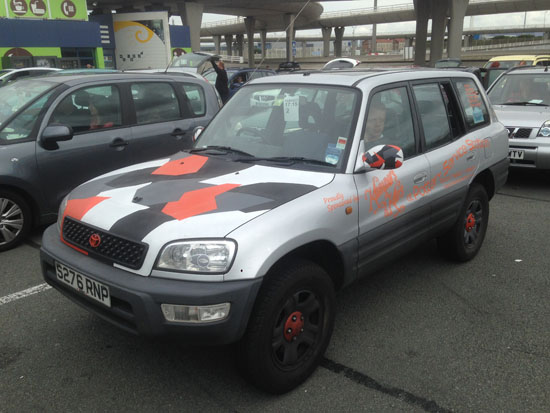 Awaiting the ferry back to England; the Toyota was travel-stained and had suffered a vandalised quarter window, but was still running perfectly and had helped to raise much money for the Dementia UK charity. (Photo courtesy Niall Brown).