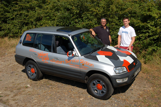 Ready for the journey… Major sponsor Andy Saunders (left) and Niall Brown (right) with the 16 year old Toyota RAV4 in which Niall and his pals are driving to Bratislava in Slovakia, raising money for Dementia UK.