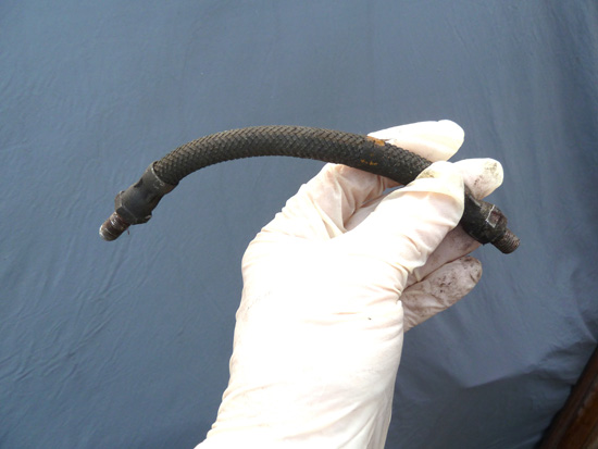 This flexible hose from a hydraulically activated clutch system looked fine from the outside, but was almost completely choked within, due to disintegration of the internal walls. This resulted in severe clutch slip after every gearchange, due to the fluid being unable to move rapidly back through the hose to the master cylinder and its fluid reservoir